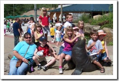Kids pose with Grandma at the Kids Kingdom